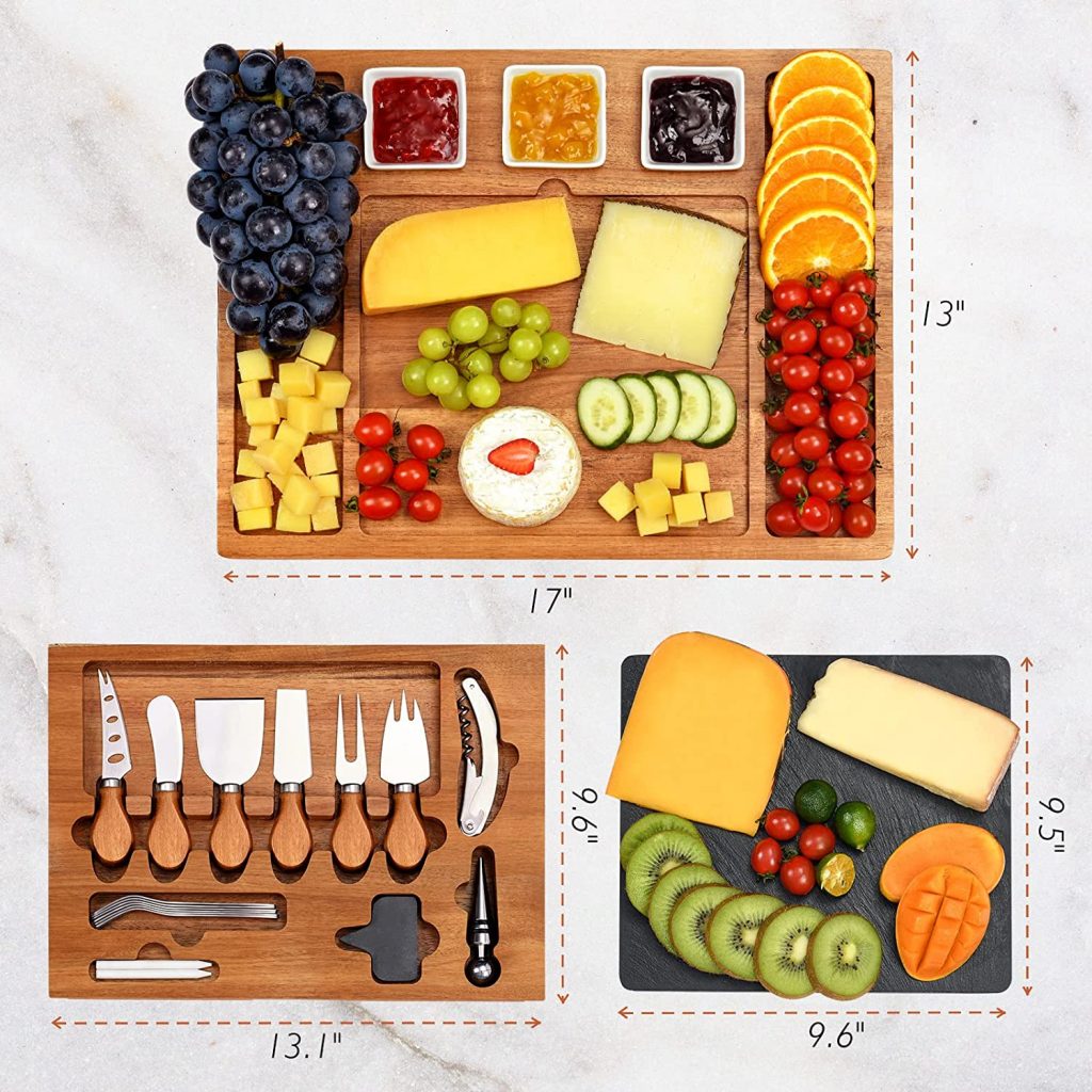 Picture of a cheese board, slate board, and a full set of cheese utensils.